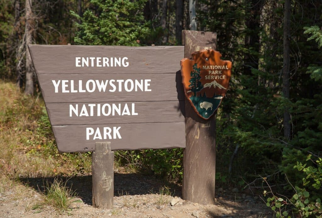 Entrance Sign Along Cave Road In Yellowstone National Park, Wyom